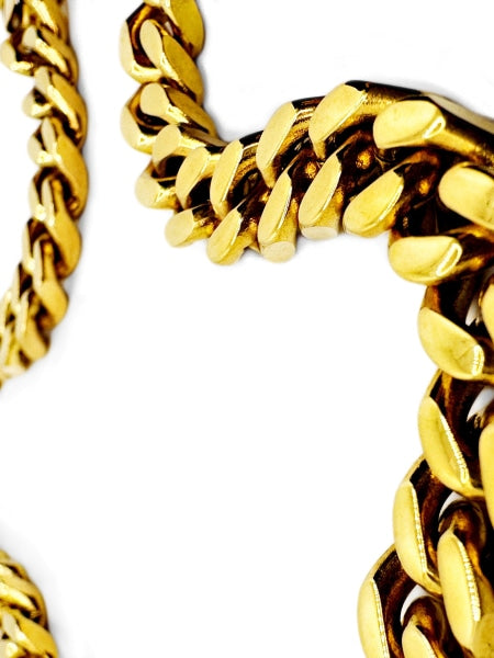 Golden colored stainless steel chain necklace.