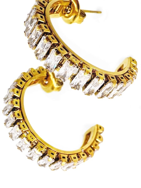 Golden colored dazzling and sparkling stainless steel hoop earrings.