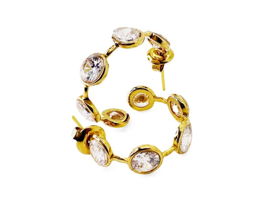 Dazzling and sparkling golden colored stainless steel hoop earrings.