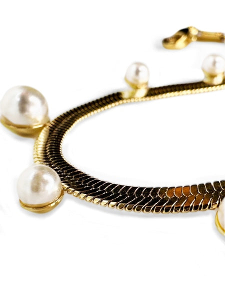 Golden color stainless steel imitation pearl bracelet.